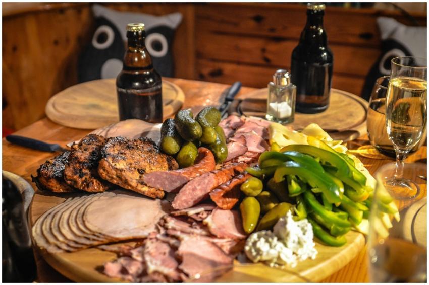 A delightful spread of meats, cheeses, and pickles