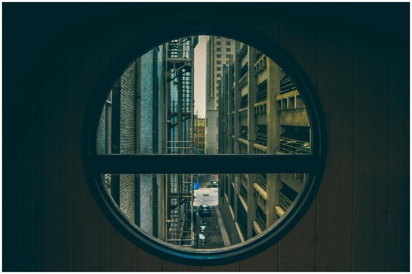 A unique perspective of an urban alley seen throug