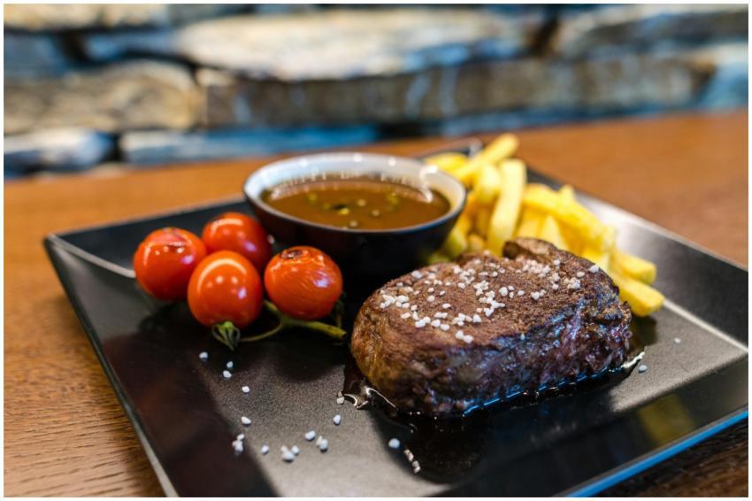 Delicious and juicy steak served with cherry tomat