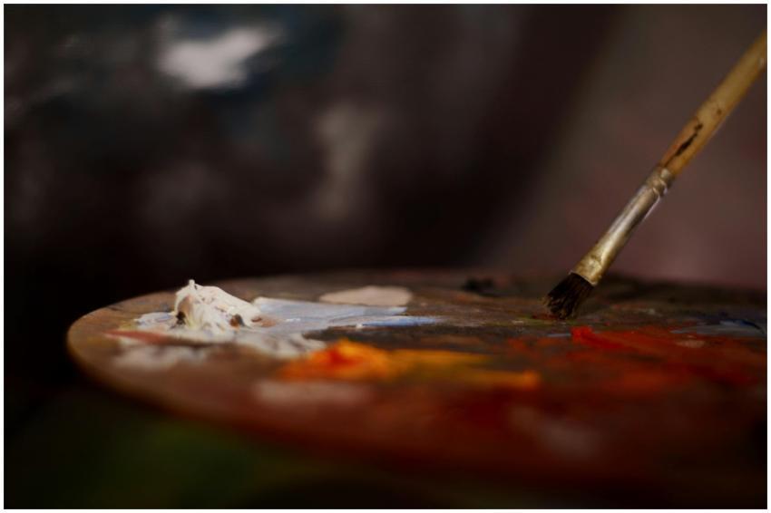 Close-up of an artist's palette with vibrant paint