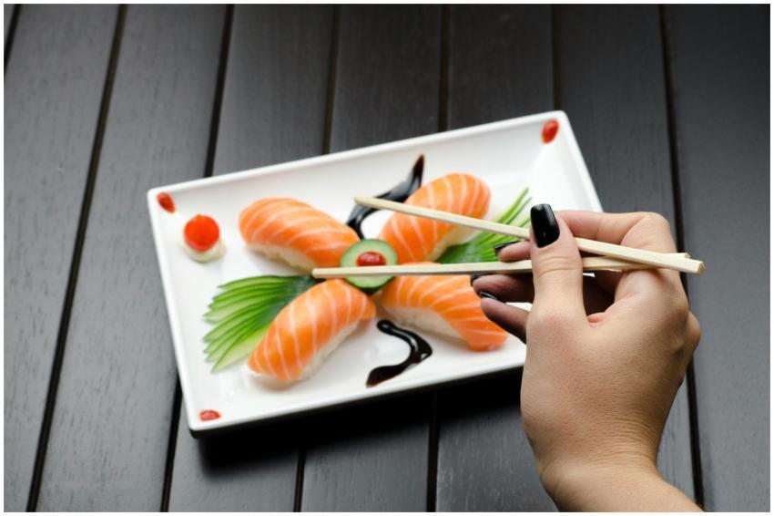 Close-up of a sushi plate with salmon nigiri and d