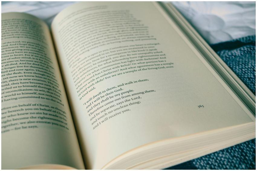 Close-up of an open book with visible text, set ag