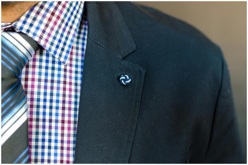 Detailed close-up of a man's checkered shirt, suit