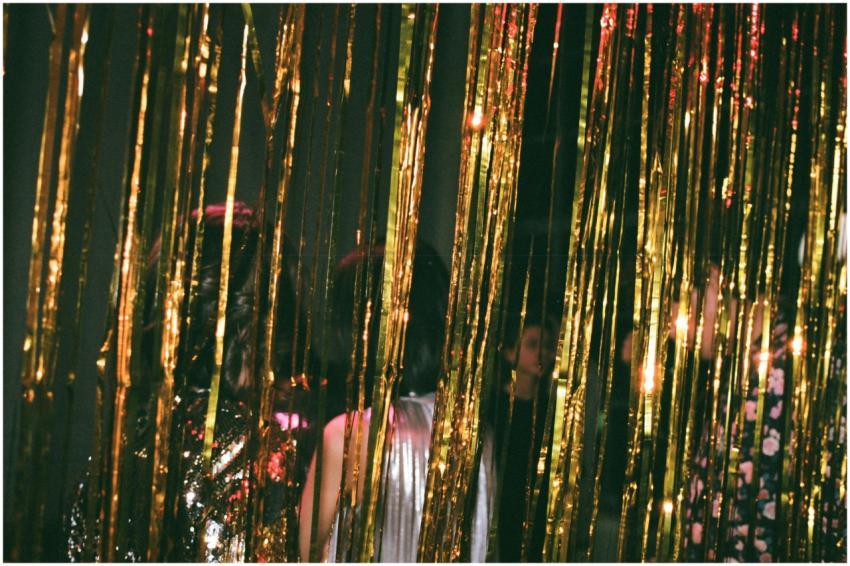 Elegant New Year's Eve party with gold tinsel and