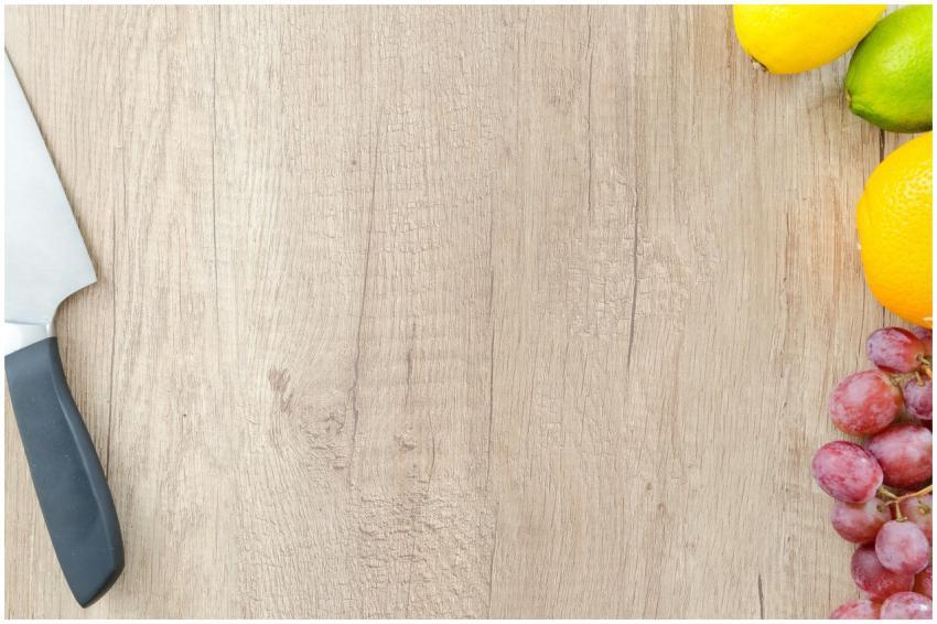 Colorful display of citrus fruits and grapes on a