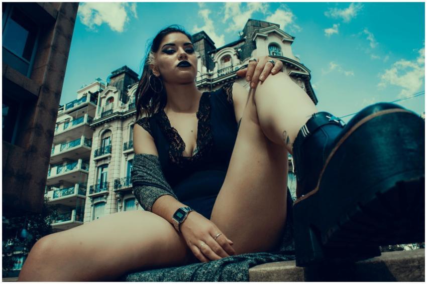 Dynamic portrait of stylish woman in urban setting