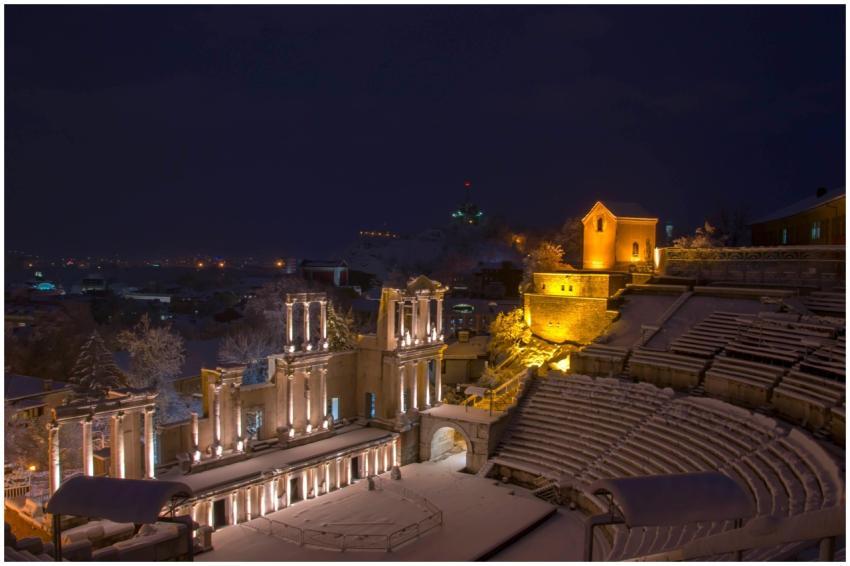 Beautifully lit ancient amphitheater during a snow