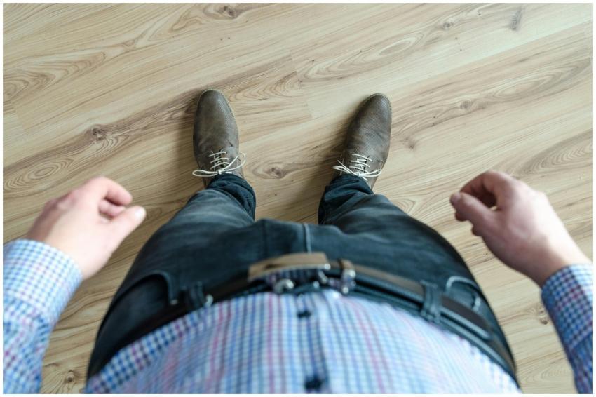 A top-down view of a man's outfit, showcasing a ca