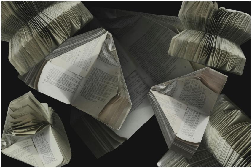 An abstract display of folded vintage books showca