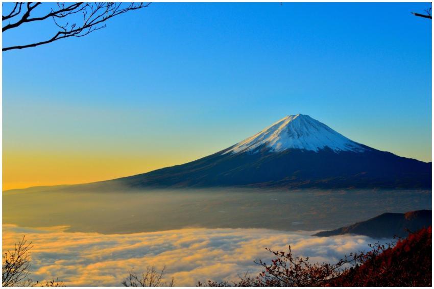 Breathtaking view of Mount Fuji at sunrise, surrou
