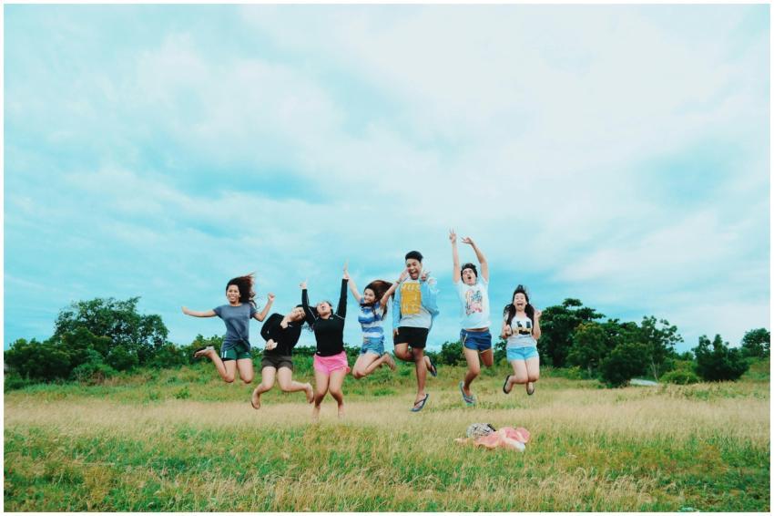 A lively group of friends enjoying a jump shot in
