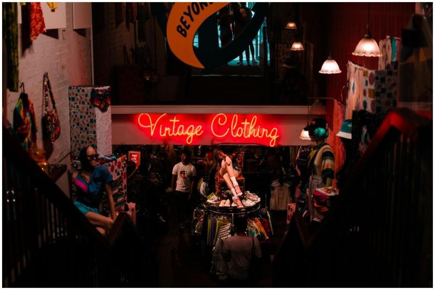 Discover a vibrant vintage clothing shop adorned w