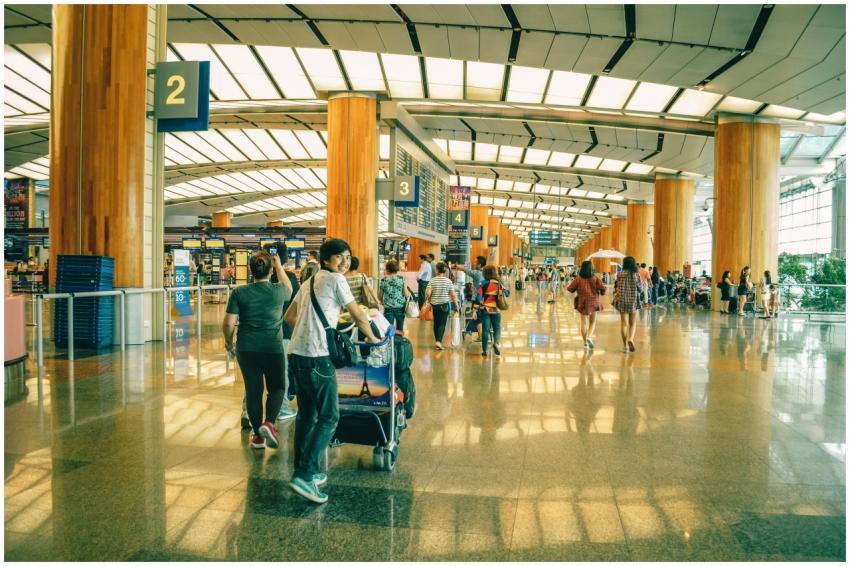 Travelers bustling through Singapore Changi Airpor