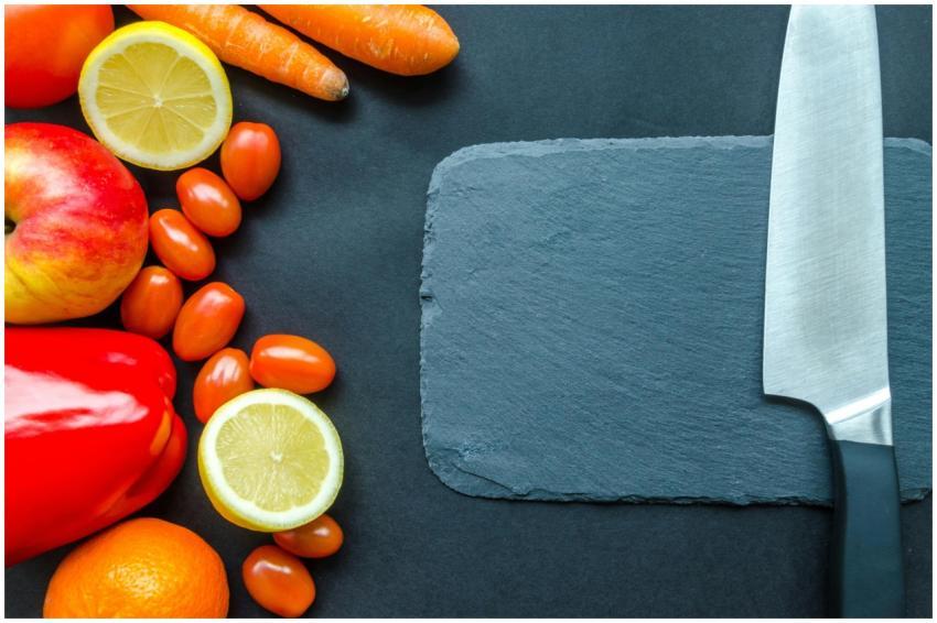 Vibrant fruits and vegetables with a stainless ste