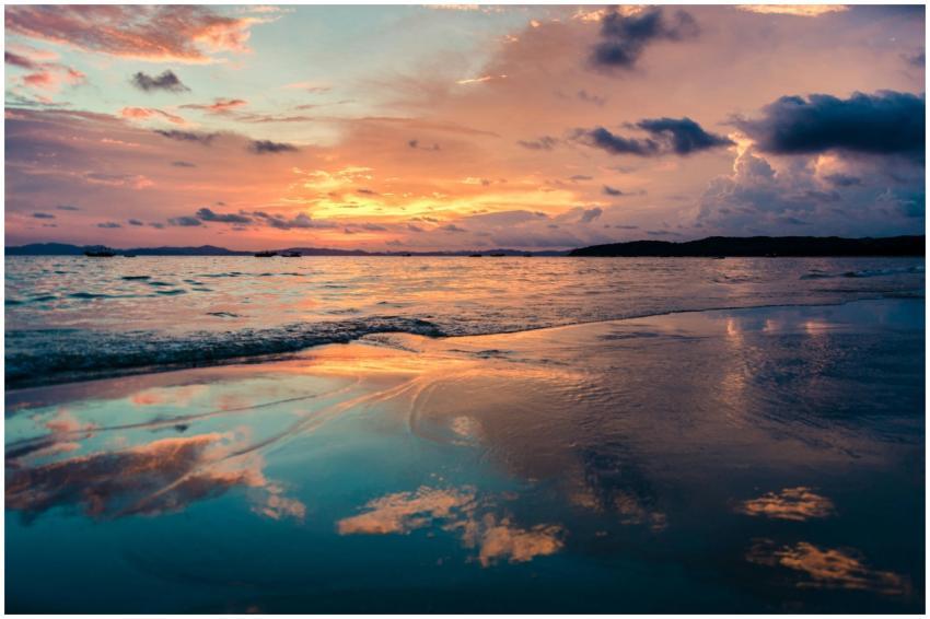 Stunning sunset over the ocean with vibrant reflec