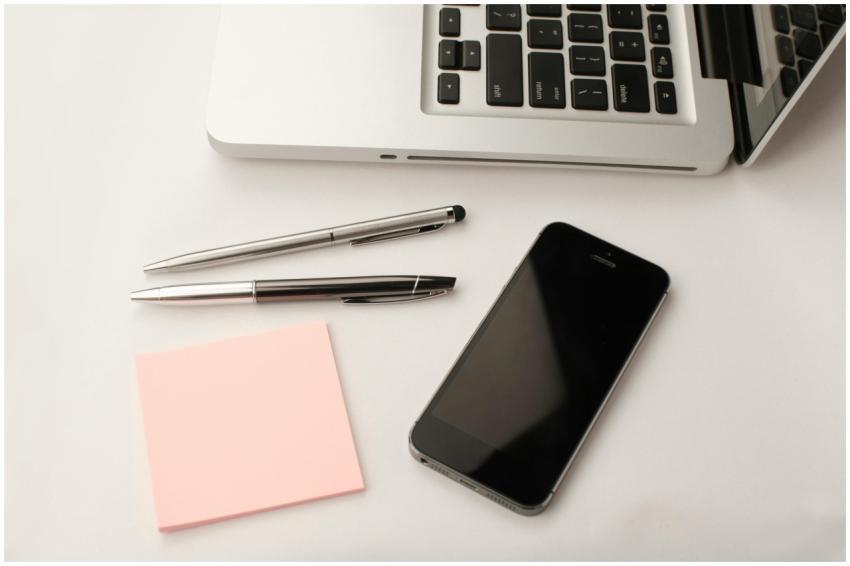 Clean and modern workspace featuring a laptop, sma