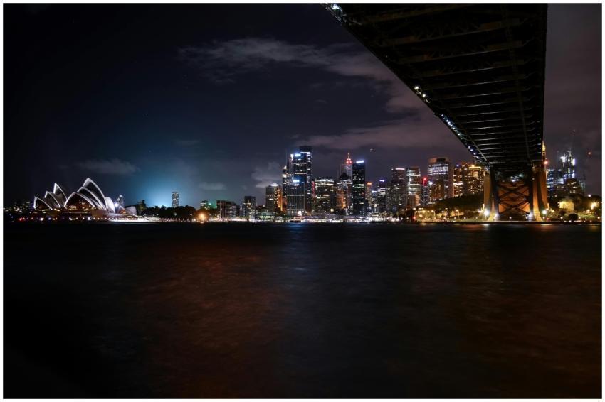 Scenic nighttime view of Sydney Opera House and ci
