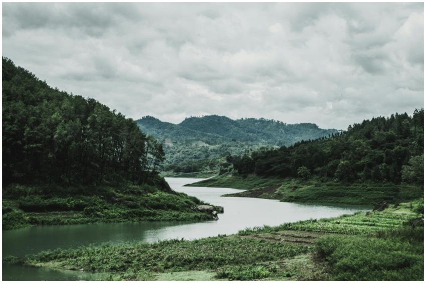 Tranquil riverside scene in Jombang, Indonesia, fe