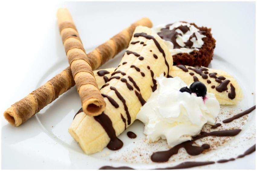 Close-up of a banana dessert with chocolate drizzl