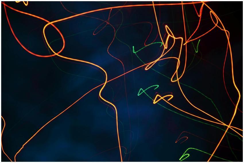 Colorful abstract light trails create a dynamic an