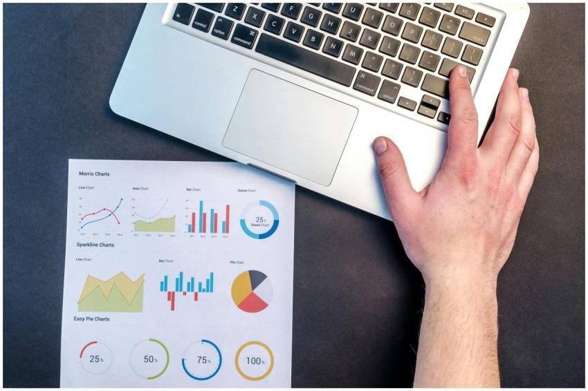 Overhead view of a business workspace with a lapto