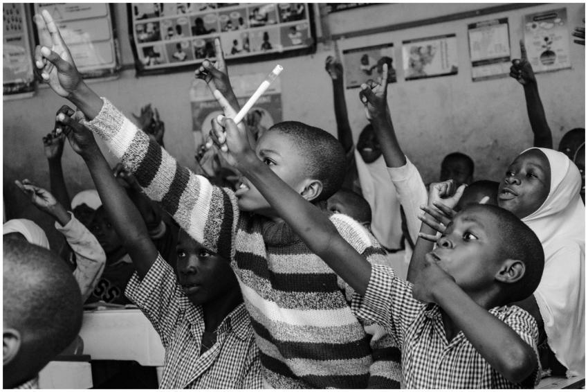 A vibrant black and white scene of young students