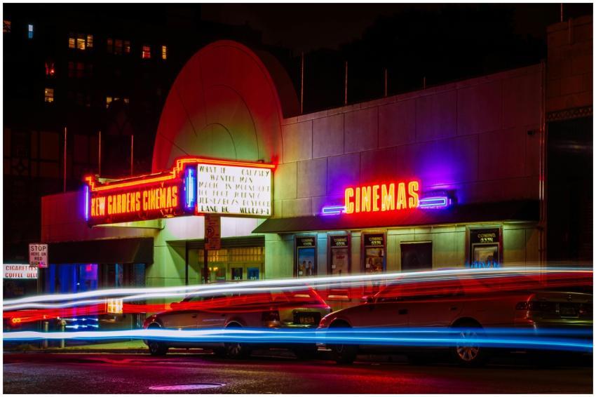 Vibrant night view of New Gardens Cinemas in Queen