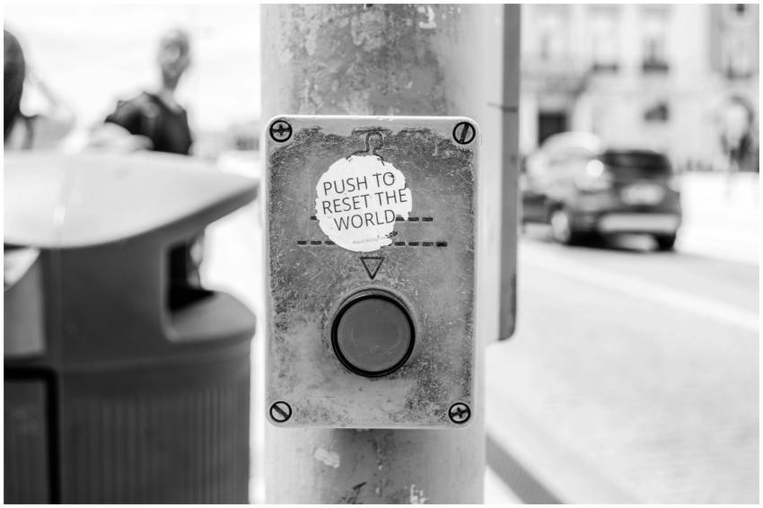 Grayscale photo of a street button labeled 'Push t