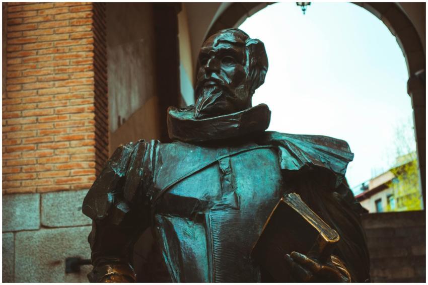 Bronze statue depicting Don Quixote, set under an