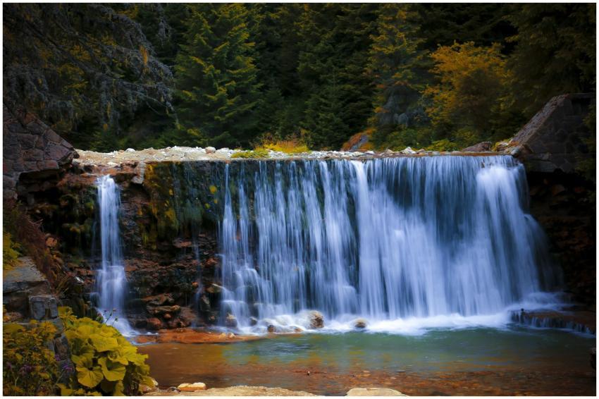 Cascading waterfall in a lush forest, capturing se