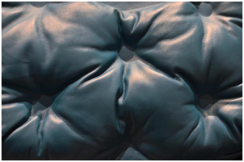 Close-up of luxurious blue leather upholstery with