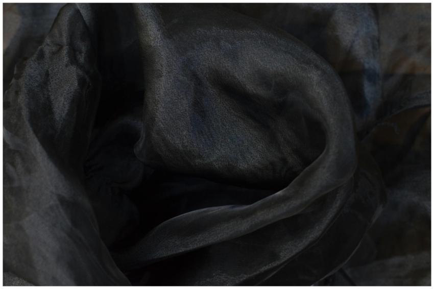Soft and dark organza fabric in a wavy, abstract f