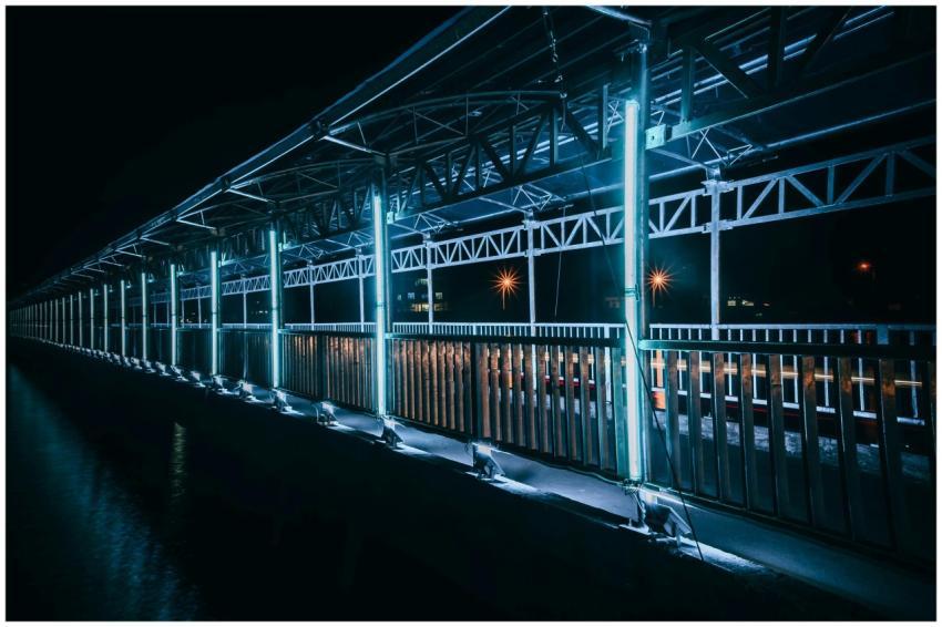 A striking view of an illuminated modern walkway a