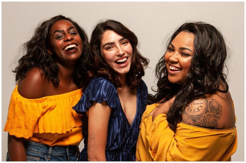 Joyful group of diverse women laughing together in