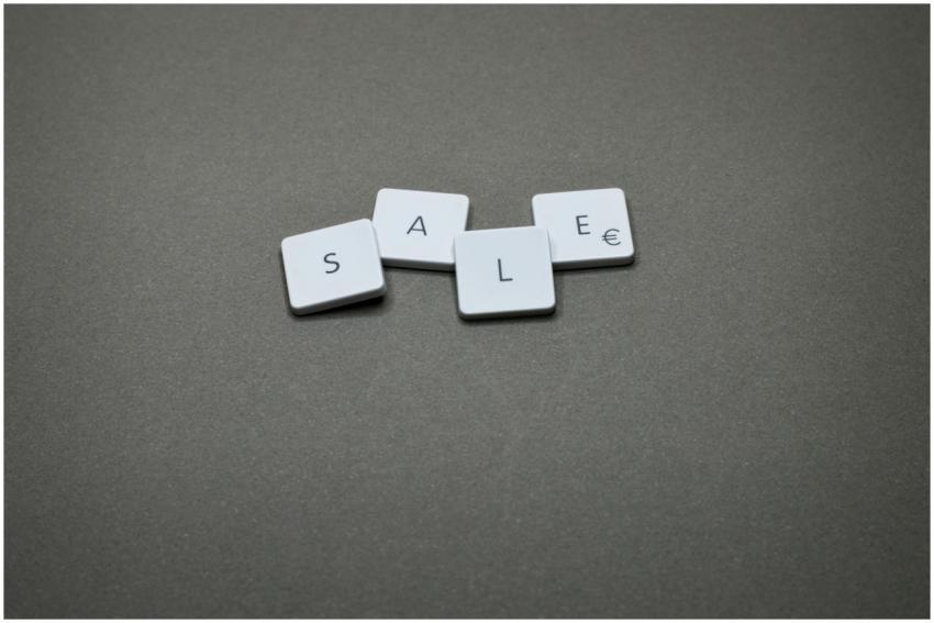 Close-up of tiles spelling 'SALE' showcasing a min