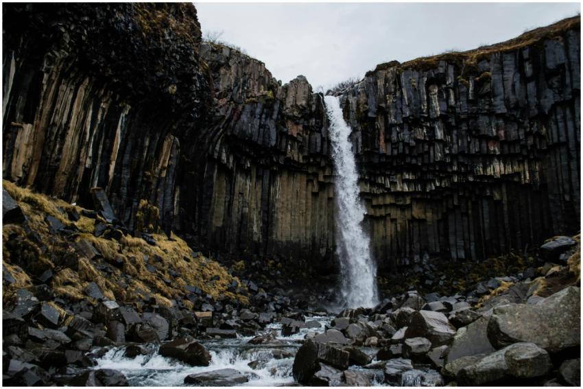 Stunning waterfall amidst basalt rock formations n