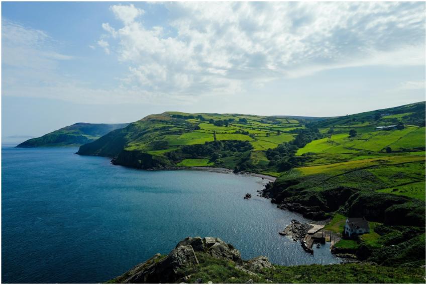 Stunning coastal landscape with lush green hills a