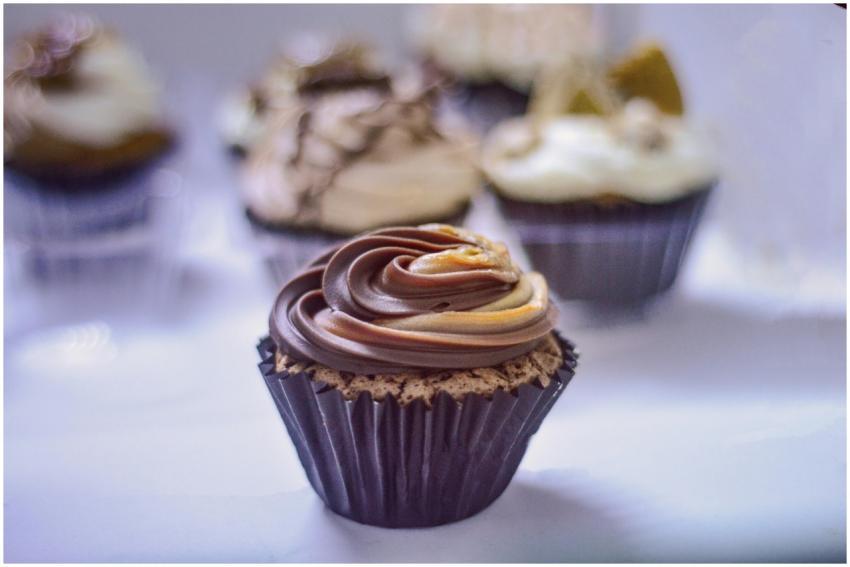 Close-up of chocolate cupcakes decorated with swir