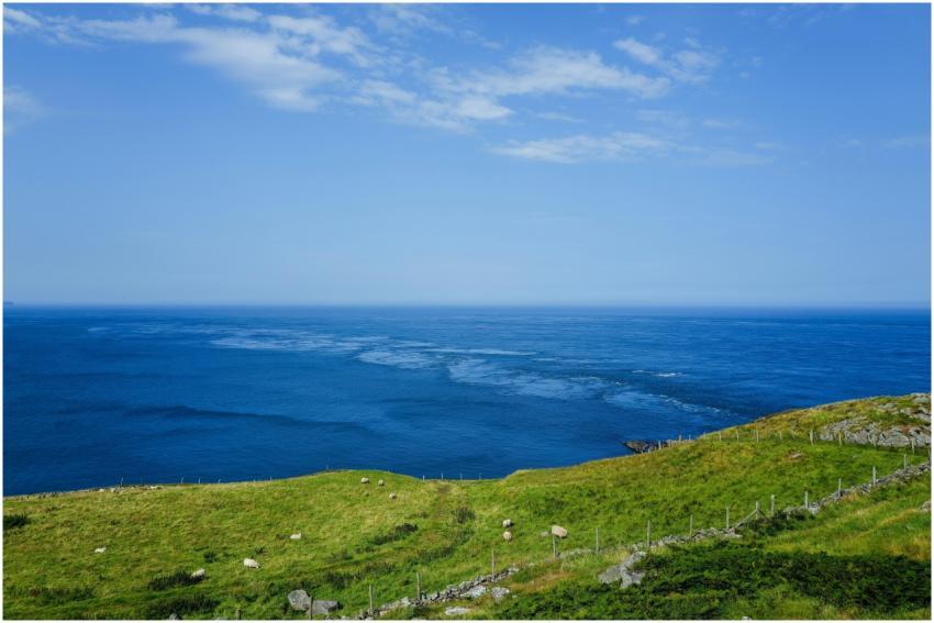A stunning coastal landscape with vibrant green cl