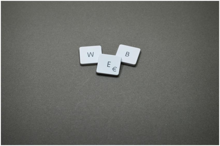 Minimalist image of keyboard keys spelling 'WEB' o