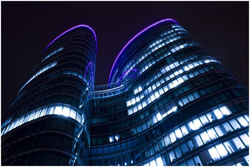 Low angle view of a modern skyscraper with glowing