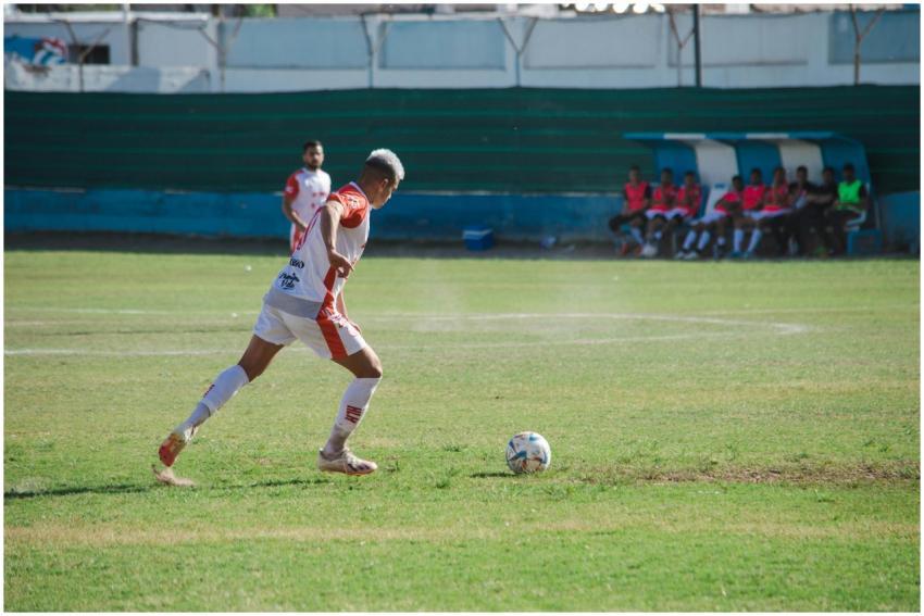 Male soccer player in action on the field during a