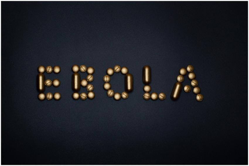 Medicinal pills arranged to spell 'EBOLA', symboli
