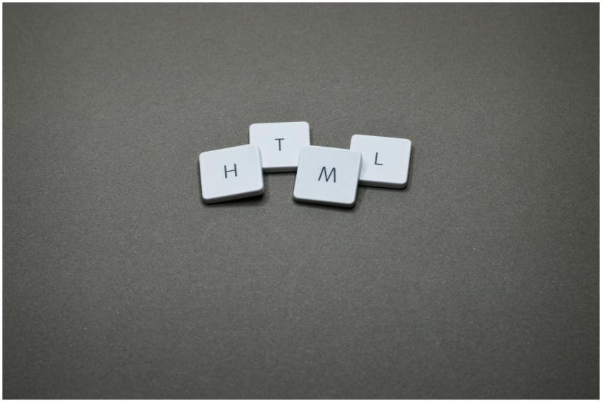 Minimalist image of HTML keycaps against a gray ba