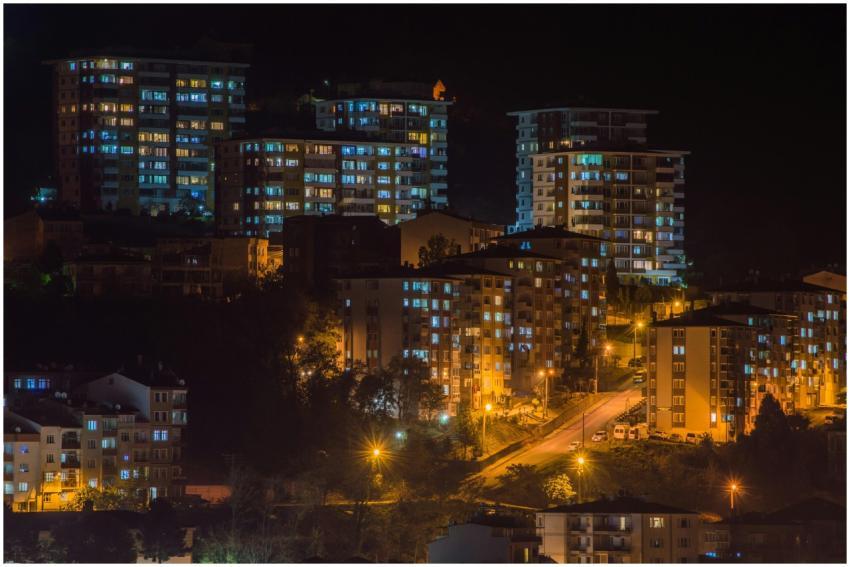 Stunning night scene of city buildings lit up in G