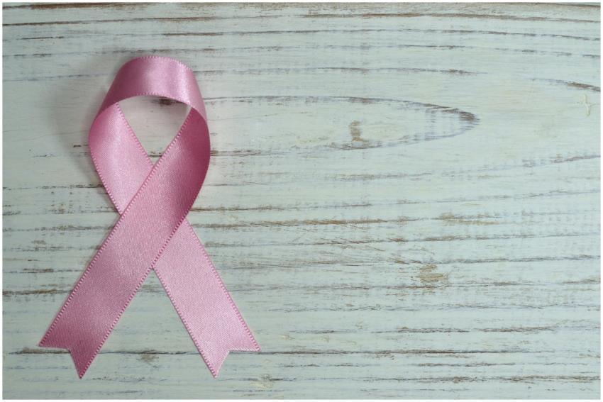 A pink ribbon symbolizing cancer awareness placed
