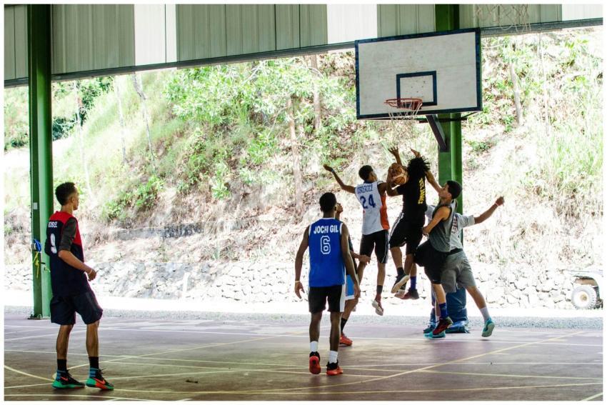 Dynamic action shot of young men playing basketbal