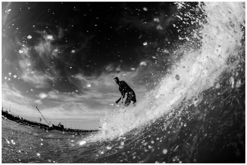Black and white photo capturing a surfer skillfull