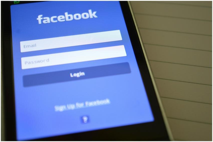 Mobile phone with Facebook login screen, highlight