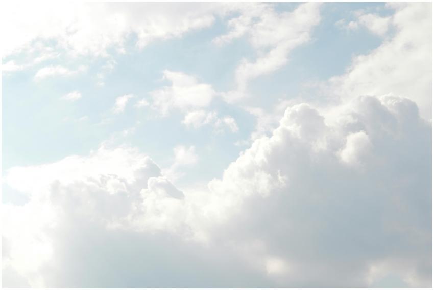 A serene view of thick, fluffy clouds set against